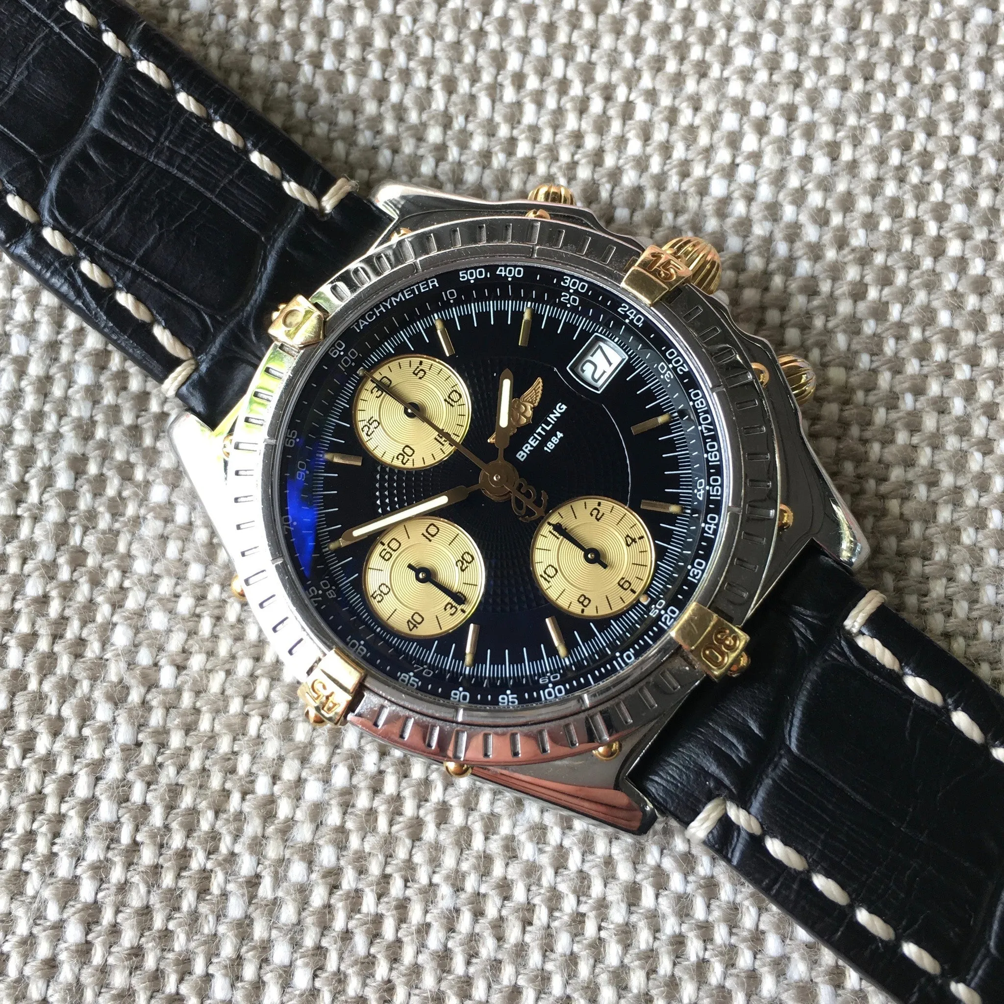 Breitling Chronomat B13050.1 Chronograph Two Tone Steel Gold Black Automatic Wristwatch