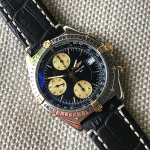 Breitling Chronomat B13050.1 Chronograph Two Tone Steel Gold Black Automatic Wristwatch