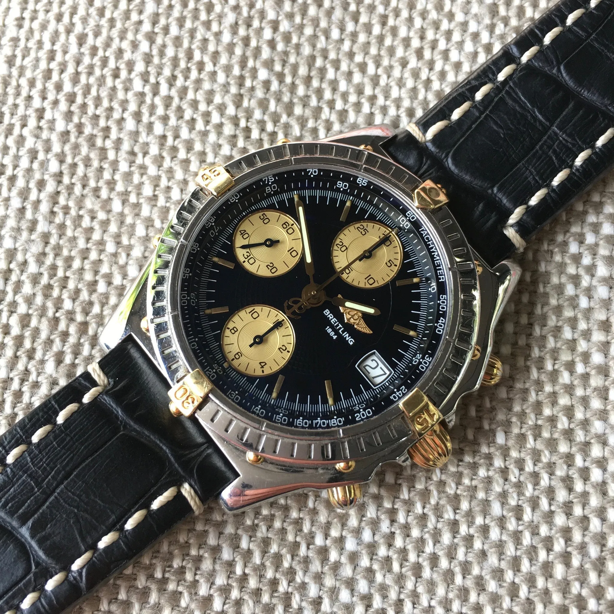 Breitling Chronomat B13050.1 Chronograph Two Tone Steel Gold Black Automatic Wristwatch