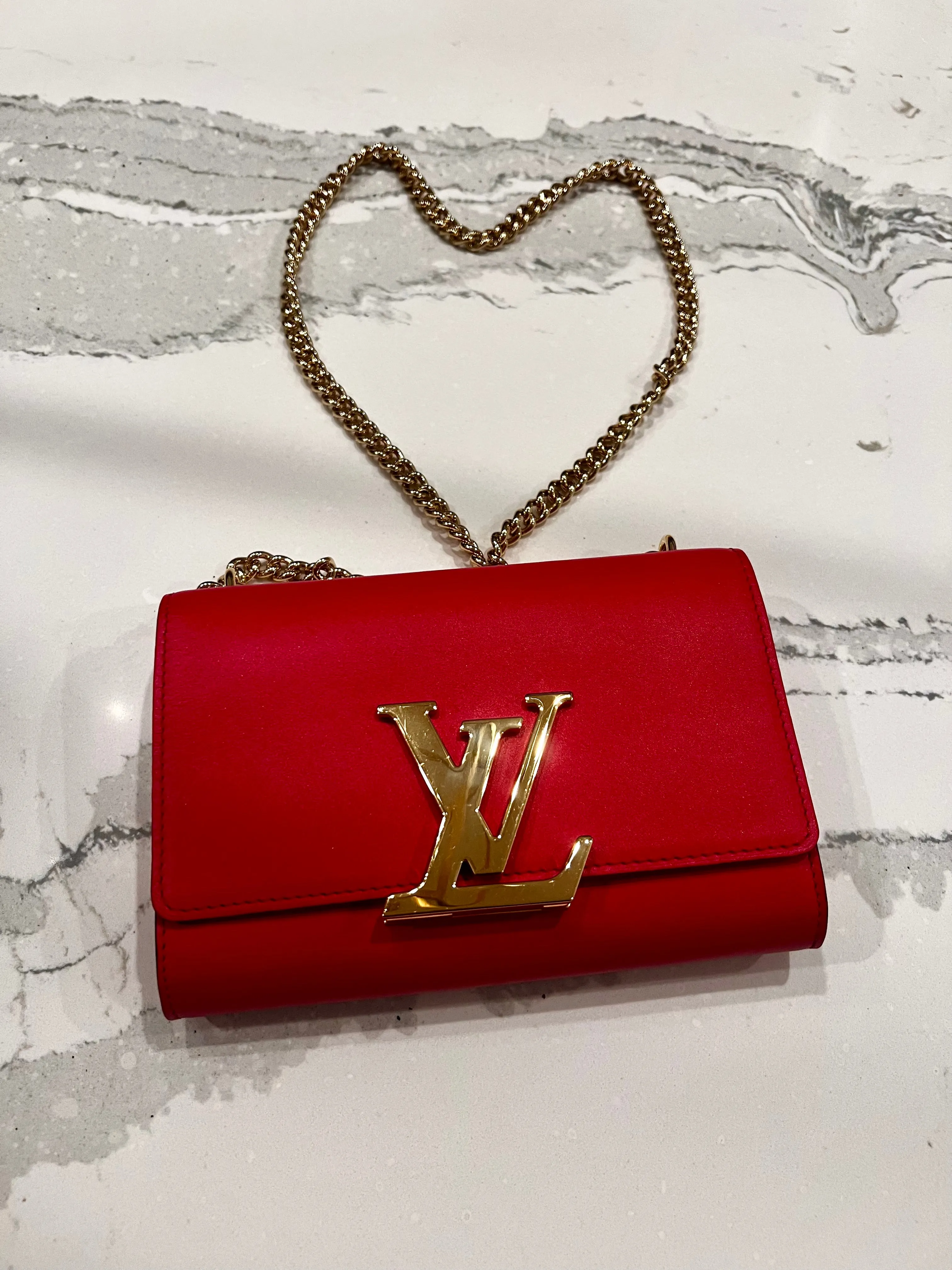 Louis Vuitton Louise red leather bag with gold chain