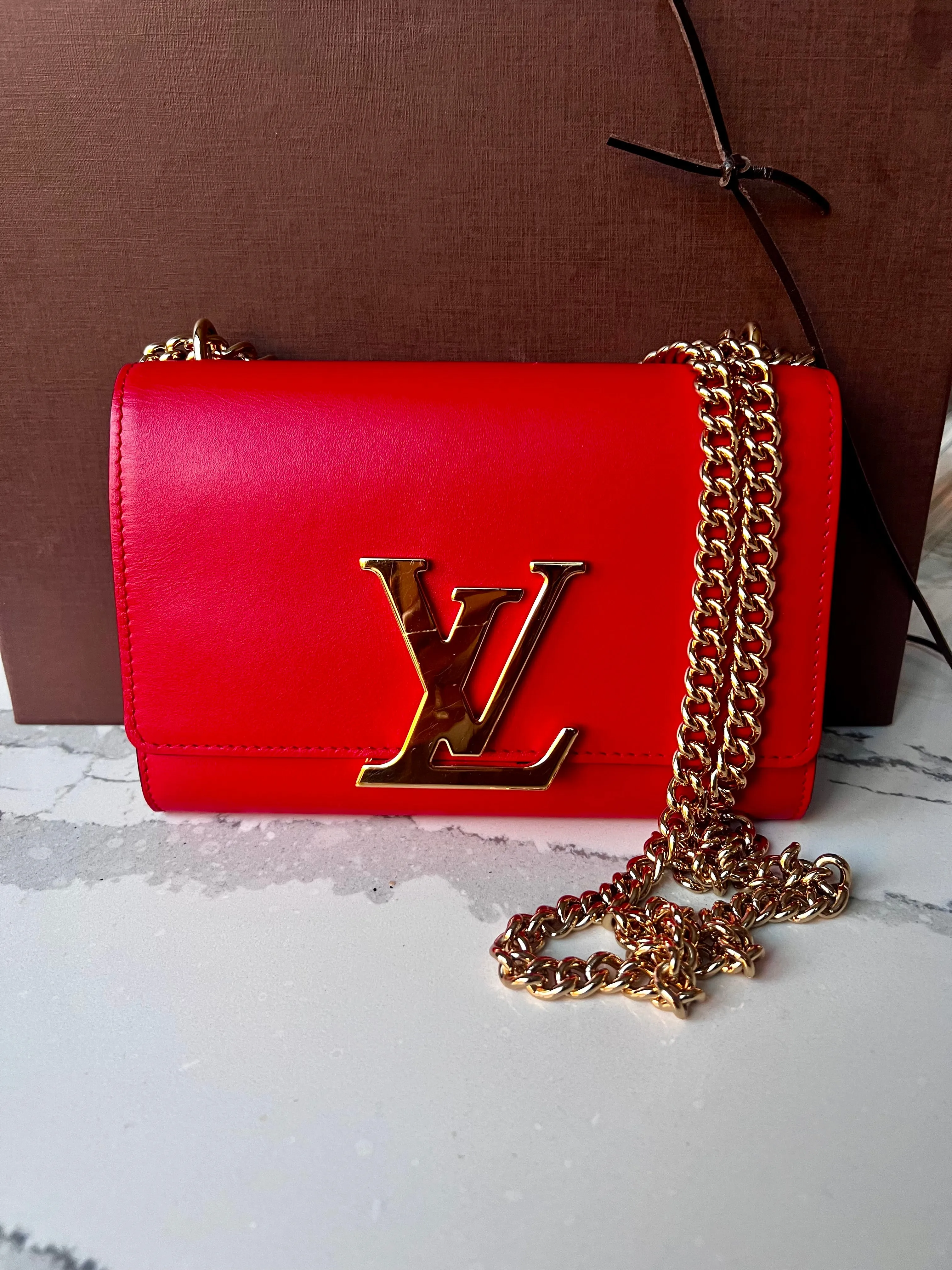 Louis Vuitton Louise red leather bag with gold chain