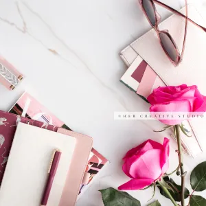 Pink Roses & Notebook & Sunglasses. Stock Photo